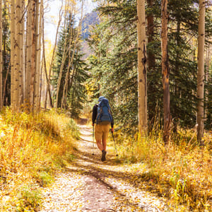 Hike in the autumn mountains. Fall season theme.
